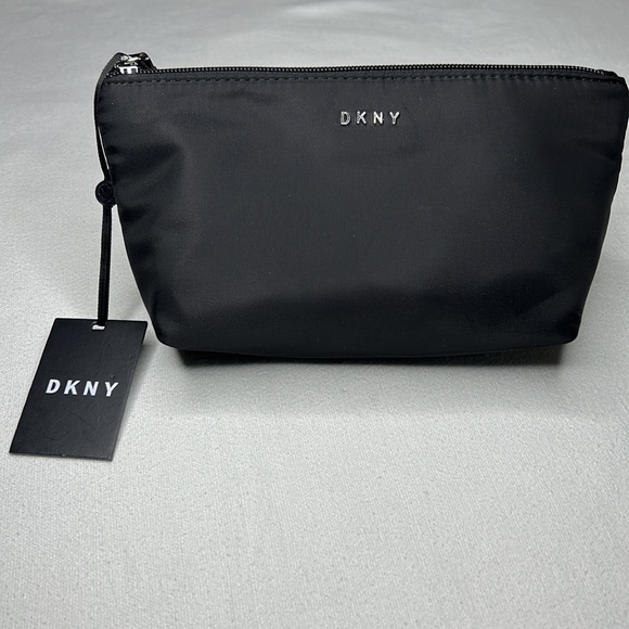 Dkny Handbags - DKNY zippered logo pouch bag. Can be used as a makeup bag.